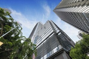 A view of tall, modern buildings with reflective glass facades and a clear blue sky. - Golden Central Hotel (Shenzhen Convention & Exhibition Center) (Shenzhen)