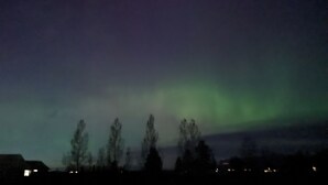 A night sky with the aurora borealis.