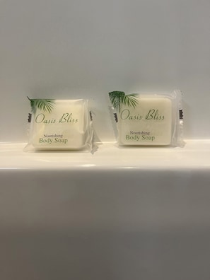 Two Oasis Bliss Nourishing Body Soap bars on a white shelf. - Circle T Mini Farms (Strawberry Plains)
