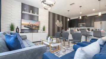 Maison mitoyenne Confort | Salle de séjour | Télévision, table de tennis de table, vidéothèque, chaîne hi-fi