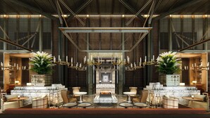 A spacious lobby with a high ceiling, modern chandeliers, and seating areas. - Intercontinental Chongli by IHG (Zhangjiakou)