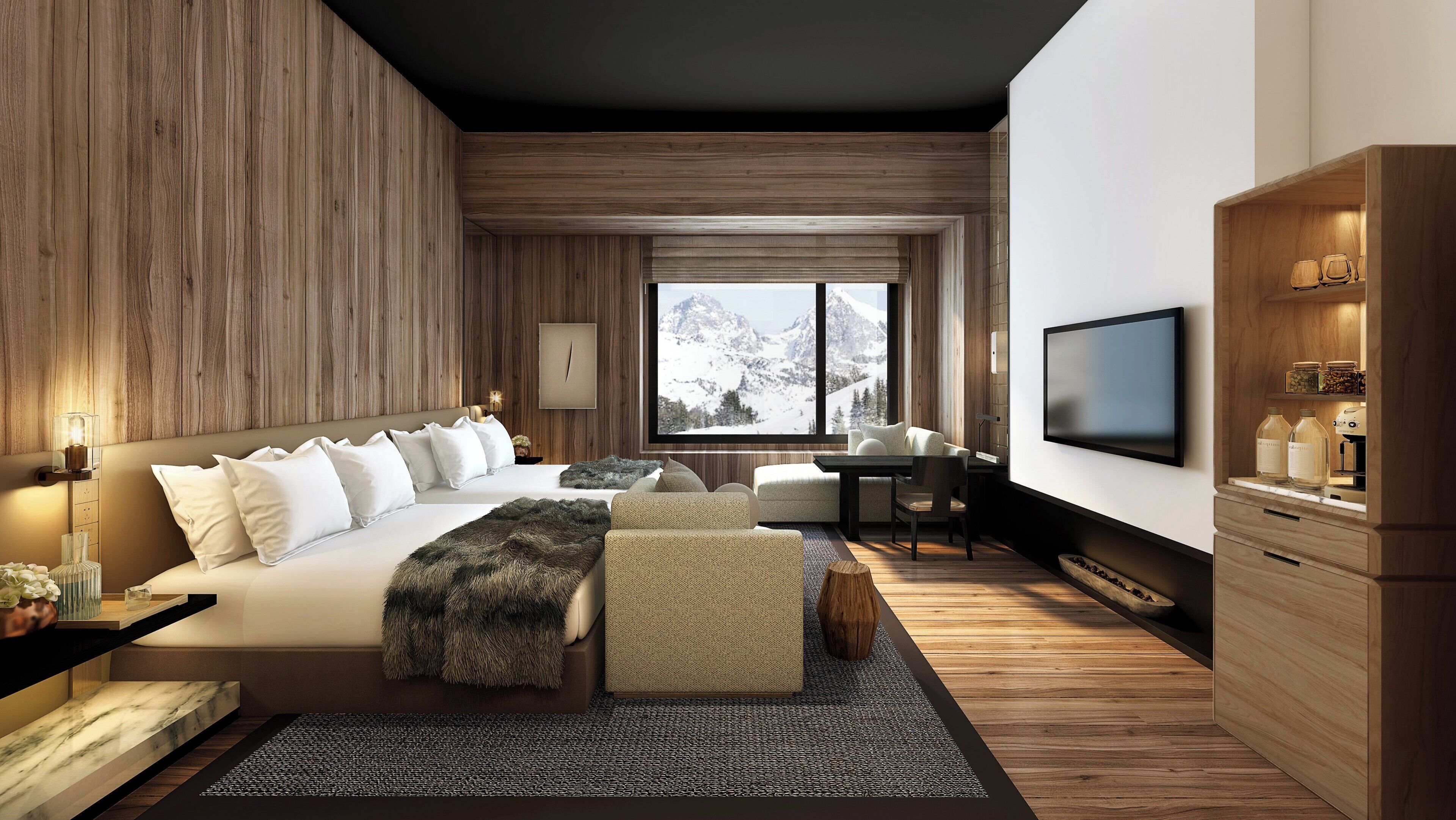 A modern bedroom with a large bed, a desk, and a television.