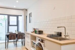 Fridge, microwave, stovetop, coffee/tea maker