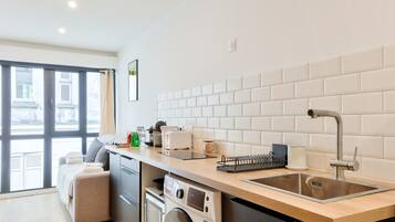 Fridge, microwave, stovetop, coffee/tea maker