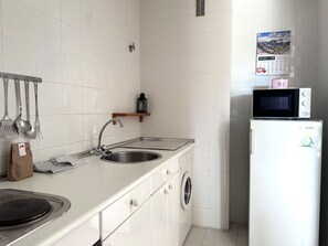 Microwave, coffee/tea maker, toaster, cookware/dishes/utensils