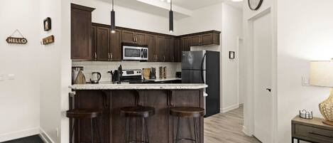 Coffee/tea maker, fridge, microwave, oven