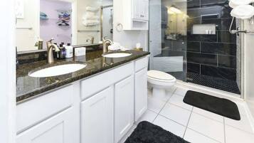Shower, hair dryer, towels, shampoo