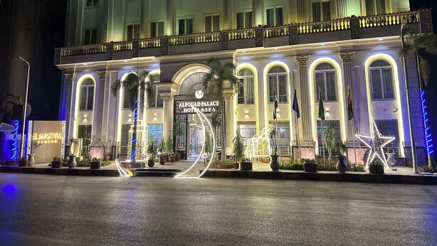 A grand hotel facade with classical architecture, featuring columns, arched windows, and a prominent entrance. - Alfouad Pyramids View Hotel (Giza)