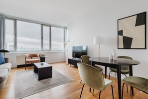 TV, stereo - Clean Hell's Kitch 2BR w/ Gym & W/D, nr Pier 84 & Museum, by Blueground (Midtown)