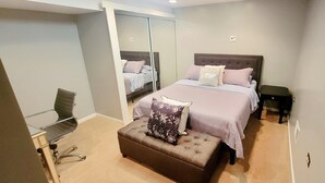 A bedroom with a bed, a desk, and a chair. - 4 Bedroom, 2 Full Bath. Centrally Located. Near O'Hare Airport and attractions   (Glenview)