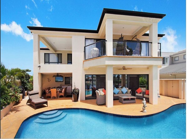 Outdoor pool, a heated pool - Beautiful and Modern Family Home with Heated Pool - Water View (Bundall)