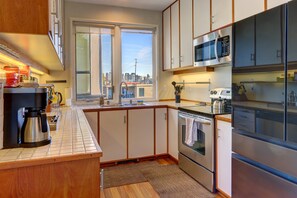 Fridge, microwave, oven, stovetop - Third floor Condo with deck and stunning views of Lake Union (Seattle)