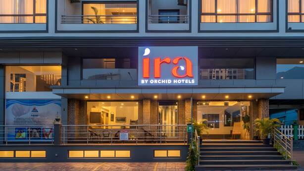 The exterior of the Ira by Orchid Hotels, featuring a modern facade, large windows, and a prominent entrance with steps leading up to the door. - Ira by Orchid, Porvorim, Goa (Porvorim)