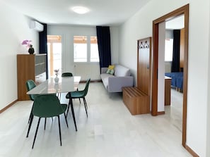 Superior Apartment, Park View | Living area | 45-inch flat-screen TV with cable channels, offices - Smart Residence Aviano (Aviano)