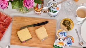 A breakfast table with cheese, yogurt, fruits, and pastries. - Residence Au Reduit - Living in the Heart of St. Moritz (San Maurizio)