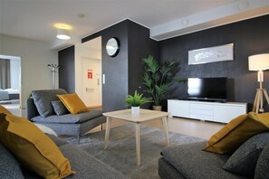 Superior Apartment | Living area | 32-inch TV with cable channels