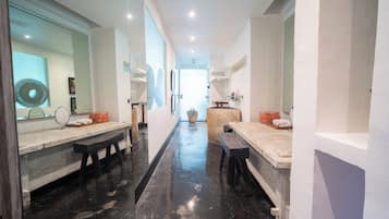 Experience a clean and bright bathroom with two vanity areas, a large mirror, and a decorative vase.