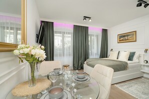 Studio, Balcony | Living area | 50-inch Smart TV with digital channels