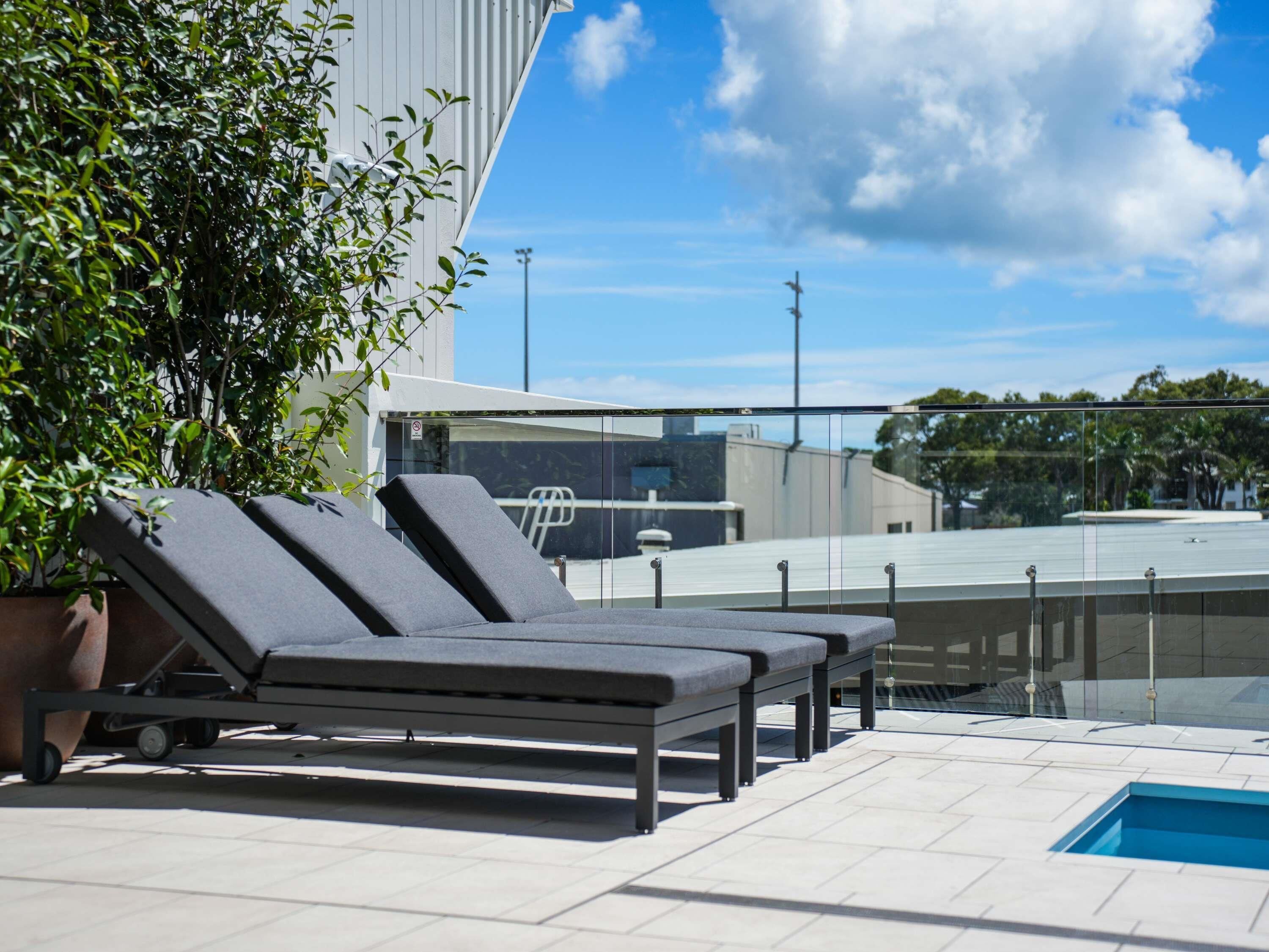 Outdoor pool, open 7:00 AM to 8:30 PM, pool loungers