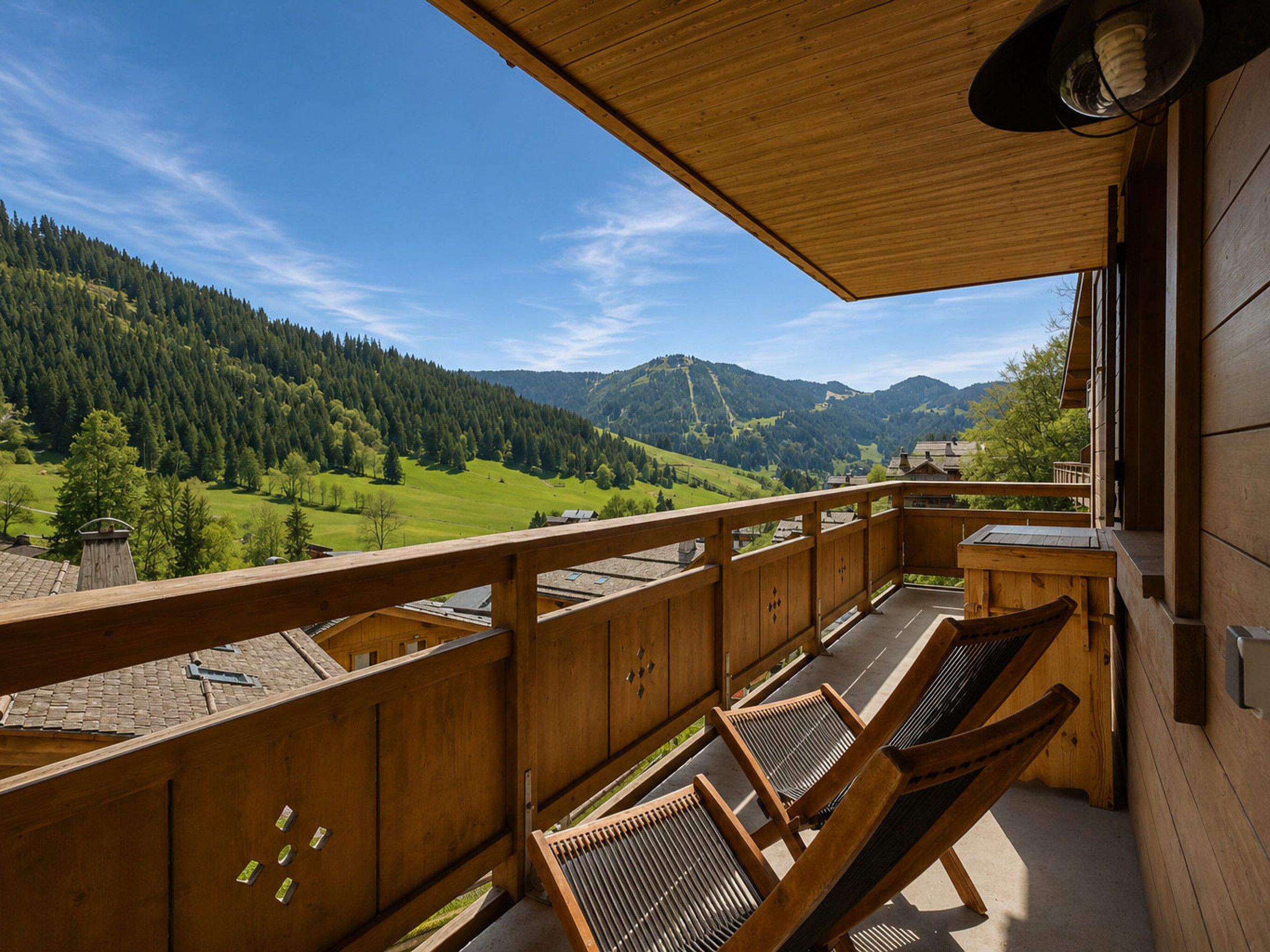 A wooden balcony with a view of a mountainous landscape.