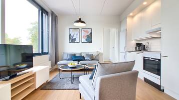 Standard Apartment | Living area | 32-inch TV with cable channels