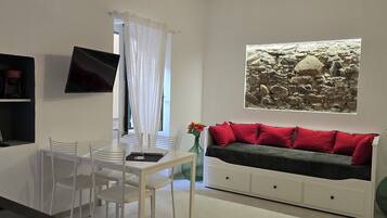 Superior Apartment | Living area | Flat-screen TV