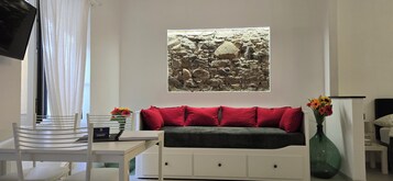 Superior Apartment | Living area | Flat-screen TV