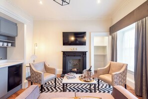 Suite estudio Elite, para no fumadores | Espacio para trabajar con laptop, cuna de viaje y wifi gratis 