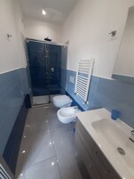 Double Room, Hill View | Bathroom | Shower, hair dryer, bidet, towels