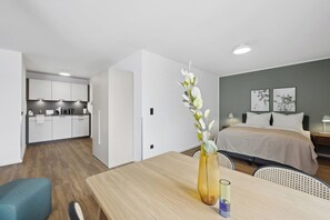 Enjoy a compact, well-designed space with a dining area, kitchenette, and cozy bedroom.