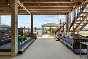 Terrace/patio - By George Waterfront - 4BR Amazing Canalfront Home - Dock & Boat Ramp! (Surf City)