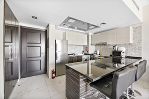 Fridge, microwave, stovetop, coffee/tea maker