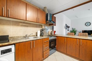 Fridge, microwave, toaster, dining tables