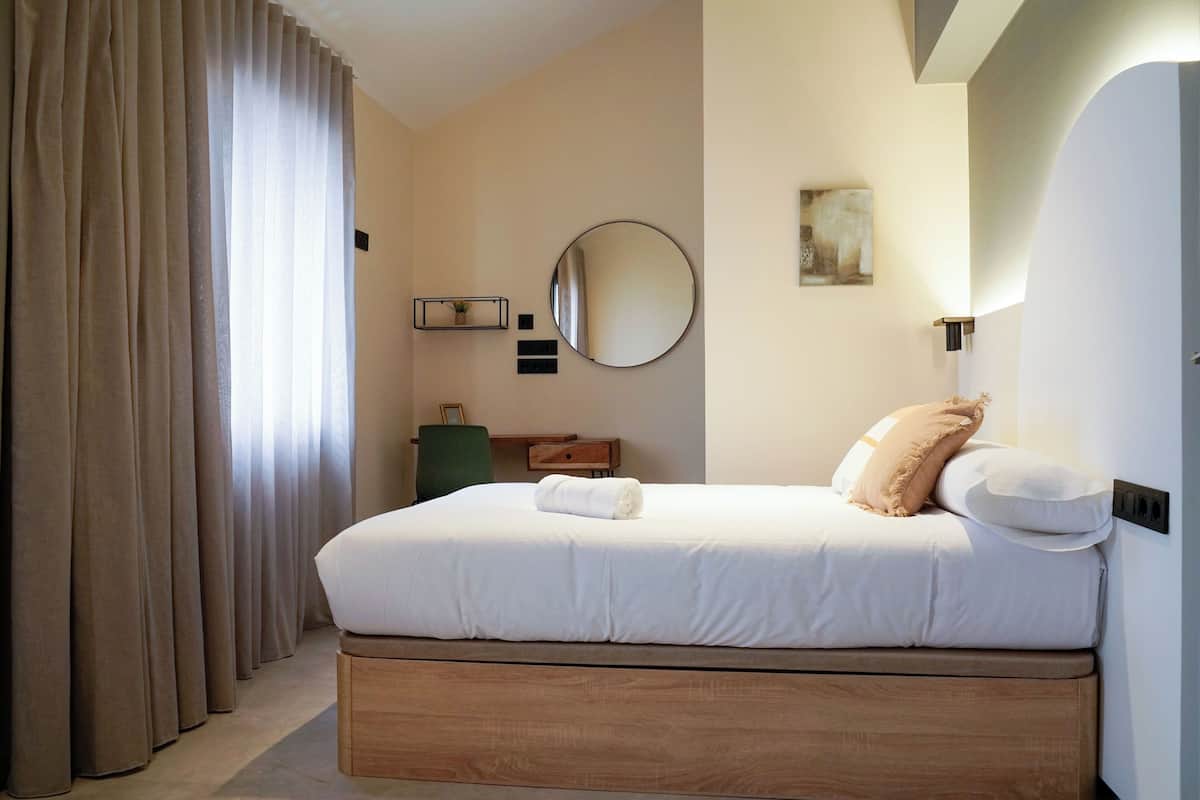 Premium bedding, down comforters, desk, laptop workspace