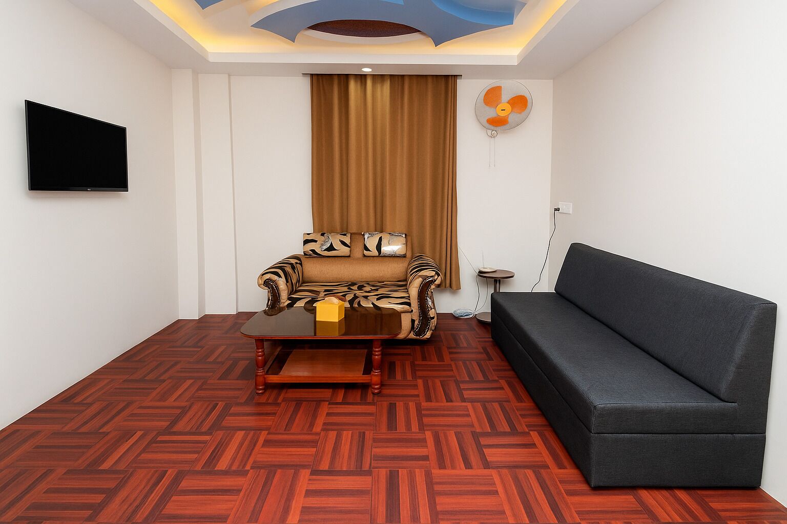 A living room with a sofa, armchair, and a coffee table.
