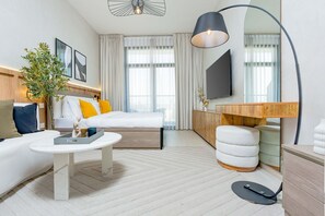 Design Apartment | Living area | 55-inch Smart TV with cable channels