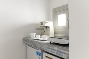Fridge, microwave, cookware/dishes/utensils, dining tables