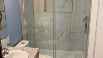 Shower, hair dryer, towels, soap