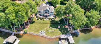 Go Jump In the Lake! Just Listed Custom Lakefront Home with Dock & Amenities!