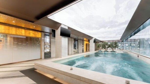 A modern indoor swimming pool with a skylight, surrounded by a minimalist design and a view of the sky. - Mei Li Hua Hotel (Dezhou)