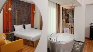 Une chambre d’hôtel moderne dotée d’un grand lit, d’un coin salon, d’une salle de bain avec une grande baignoire et d’un espace douche.