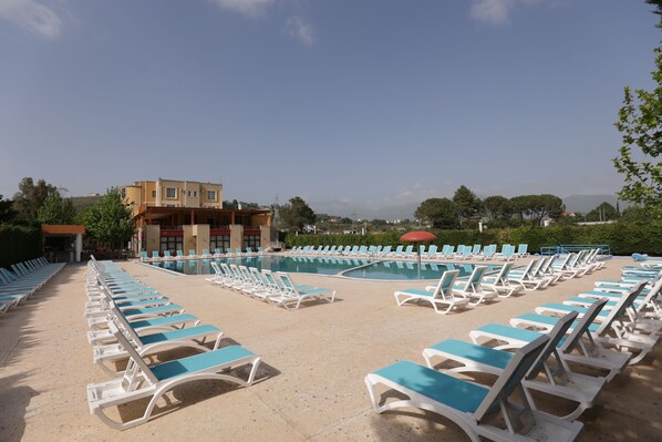 Outdoor pool, pool umbrellas, pool loungers