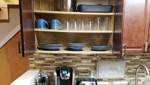 A compact kitchen with a coffee maker, toaster, and dishwasher. - 1-bedroom apartment in Albany with WiFi, AC (Menands)