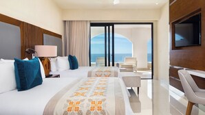 A hotel room with two beds, a TV, a desk, and a balcony with a view of the sea. - Spend your Christmas week in Cabo at Villa La Valencia (San José del Cabo)