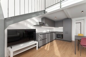 Una cocina moderna con horno empotrado, microondas y pileta.