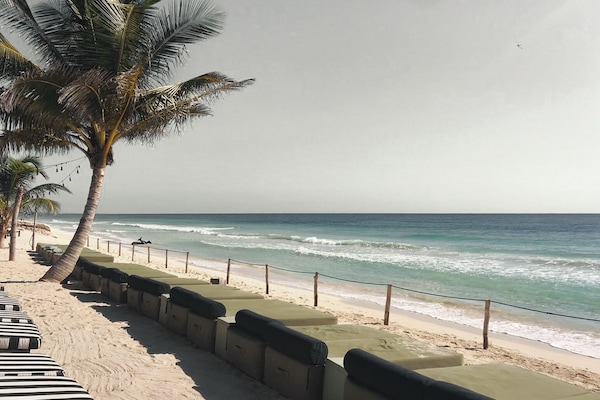 Private beach, white sand, sun loungers, beach umbrellas