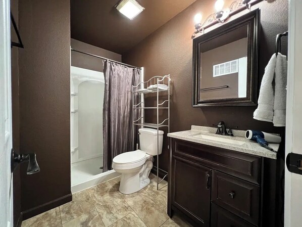 Shower, hair dryer, towels, soap