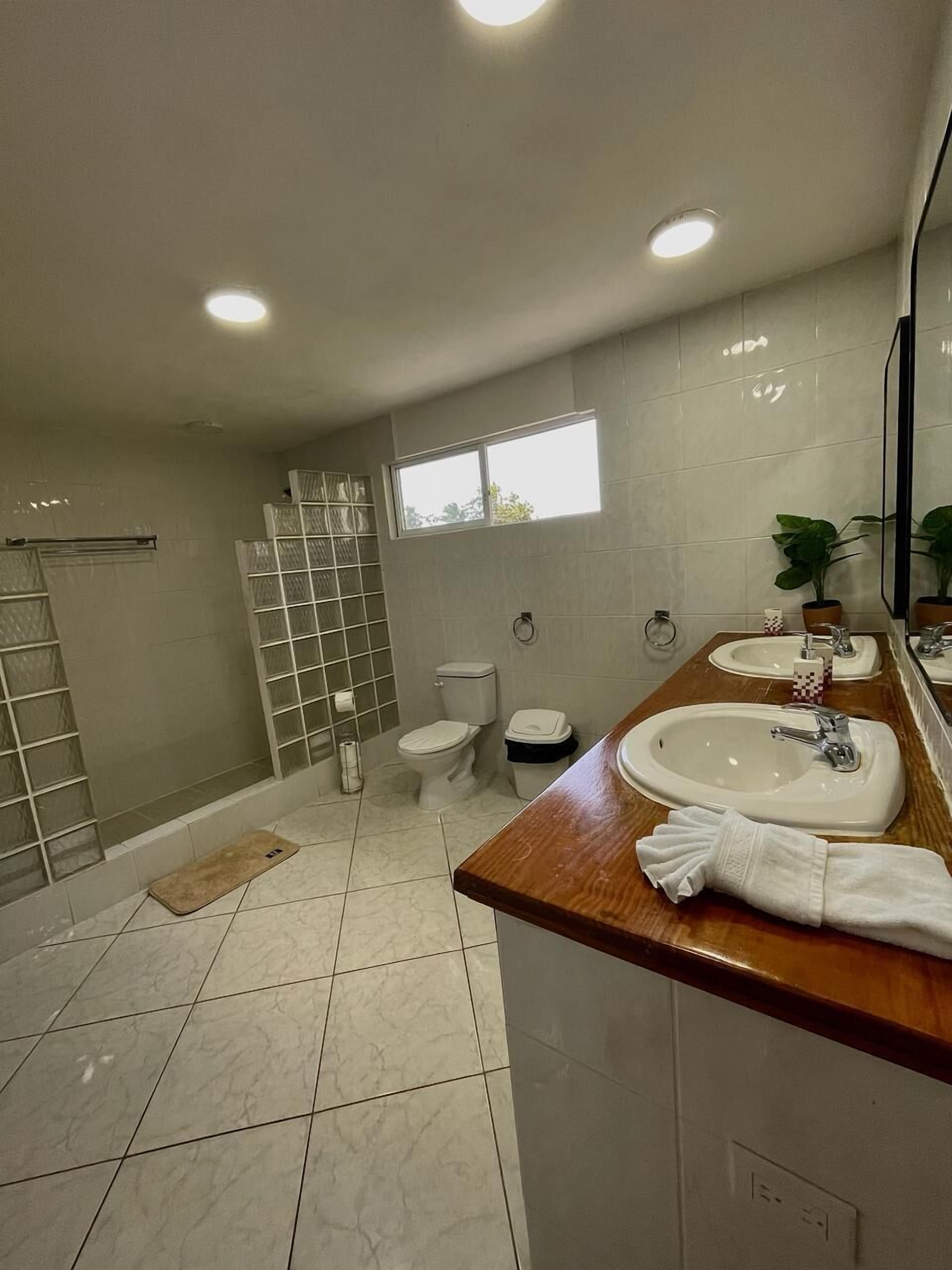 Family Twin Room, Pool View | Bathroom | Shower, towels