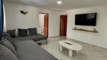 Family Twin Room, Pool View | Living area | Smart TV
