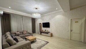 Comfort Quadruple Room | Desk, iron/ironing board, WiFi (free), bed sheets - Baurum Family Apartments (Tashkent)